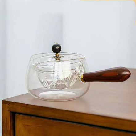 Semi-auto heat-resistant glass teapot with infuser and wood handle, perfect for easy tea at home or work.