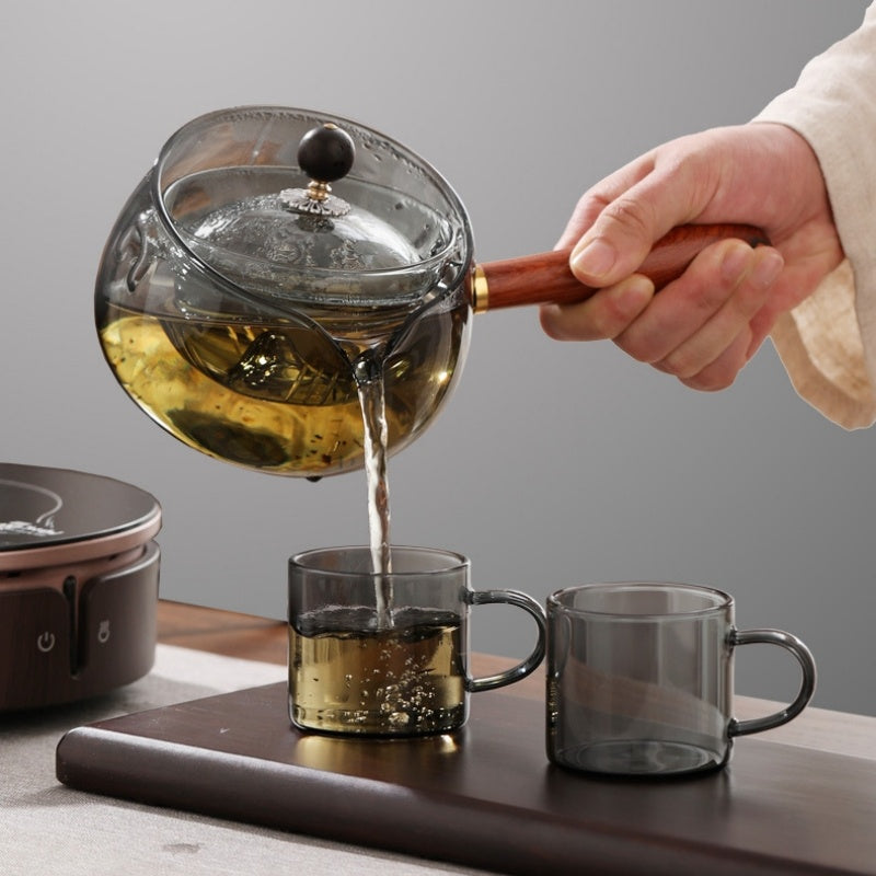 Semi-auto heat-resistant glass teapot with infuser and wood handle, perfect for easy tea at home or work.