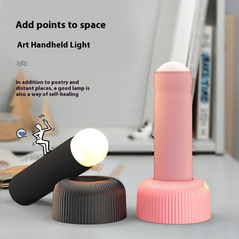 Creative Handheld Night Light: Unique LED Design with On/Off Switch and Table Base